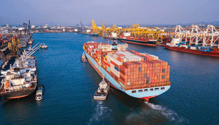 Aerial view of cargo port with vehicles queued for export shipment from USA to Nigeria